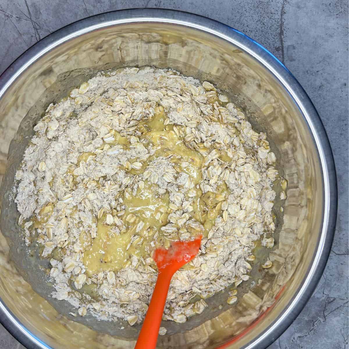 dry ingredients combined with wet ingredients in metal bowl