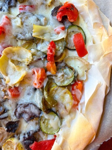 phyllo mediterranean pizza with roasted sliced squash, mushrooms and zucchini