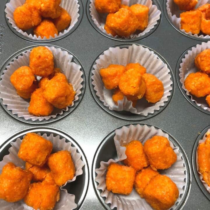 thawed sweet potato tots in muffin tin