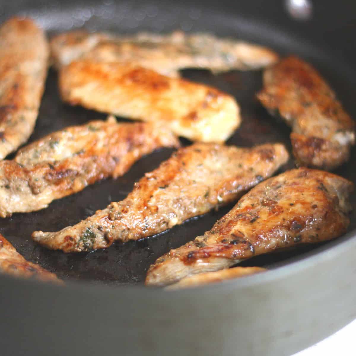 greek seasoned chicken tenders in skillet