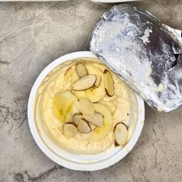 overnight oat cup -Greek yogurt cup topped with sliced banana and slivered almonds