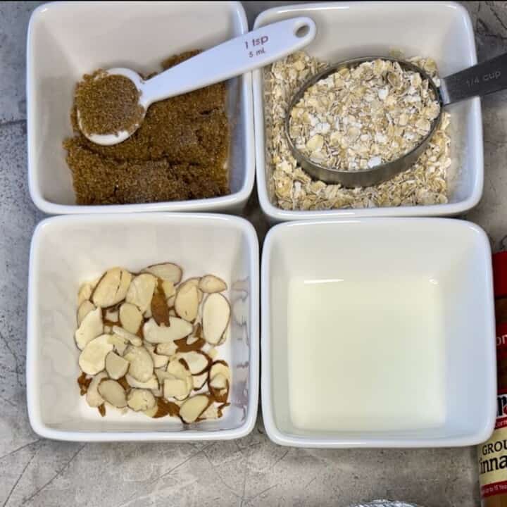 white square bowls with ingredients for diabetic overnight oats-oatmeal, brown sugar, milk, almonds