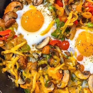 Veggies and eggs breakfast in cast iron skillet