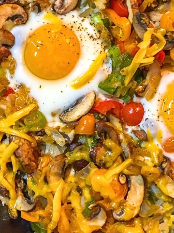 Veggies and eggs breakfast in cast iron skillet