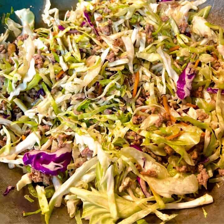 egg roll in a bowl process. Coleslaw mix in skillet.