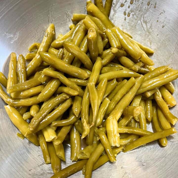 drained canned green beans in a bowl