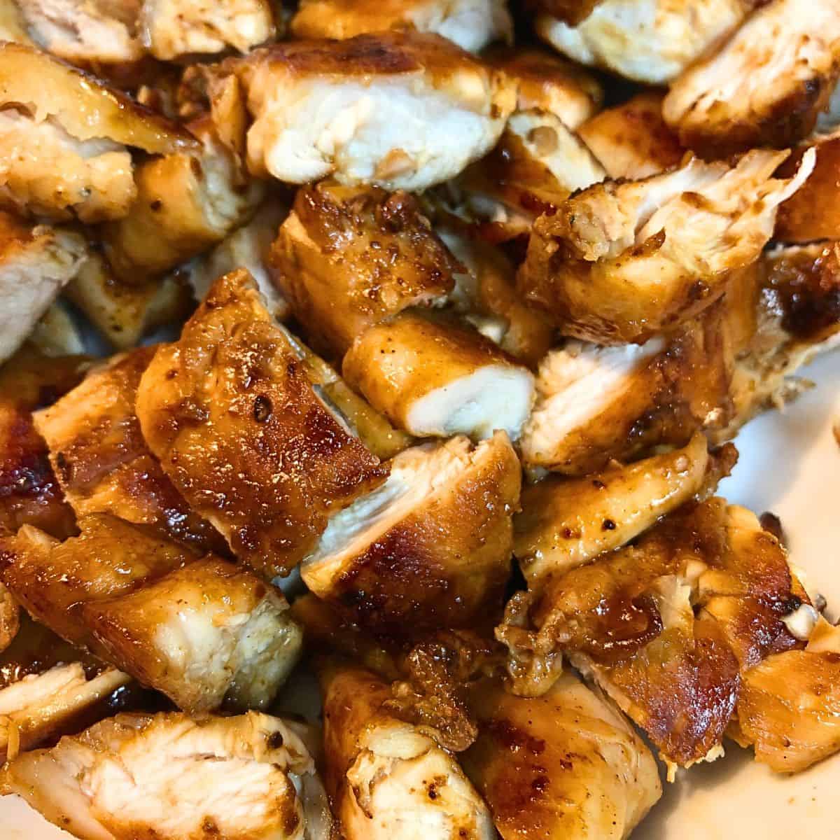 Pan seared chicken tenders cut in pieces.