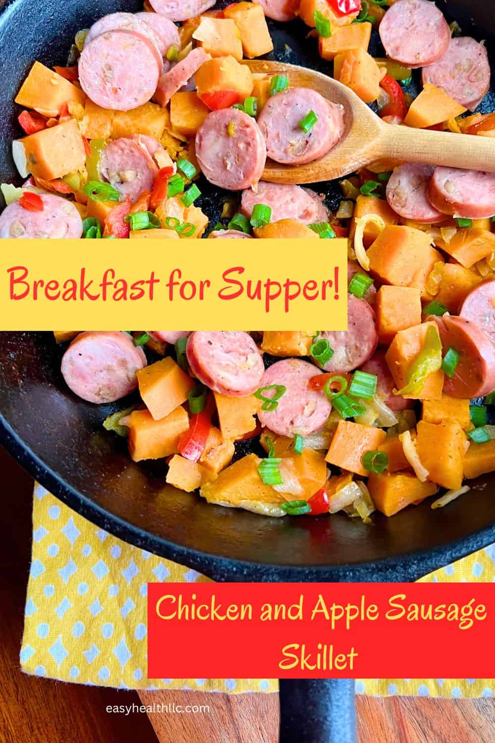 Skillet full of sweet potatoes, chicken and apple sausage and pepper and onions.