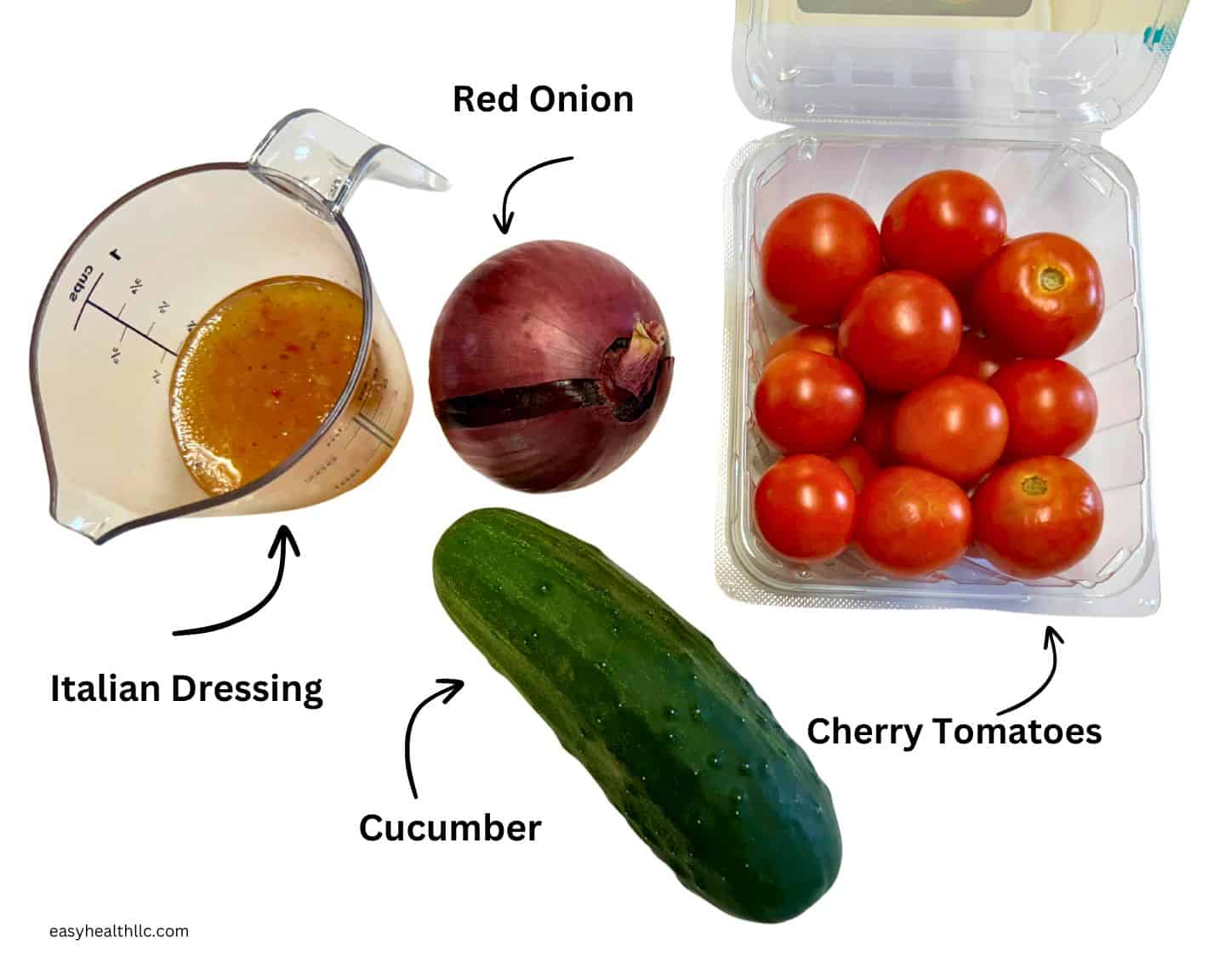 Cucumber, cherry tomatoes, red onion and measuring cup with Italian dressing.