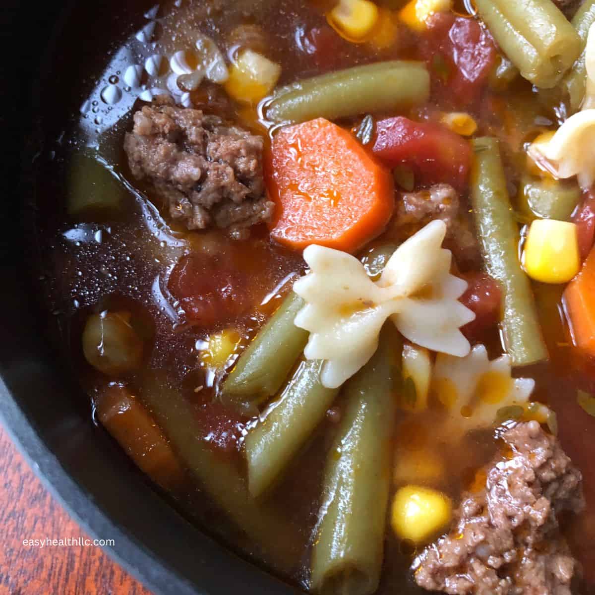 Veg beef soup in pot.