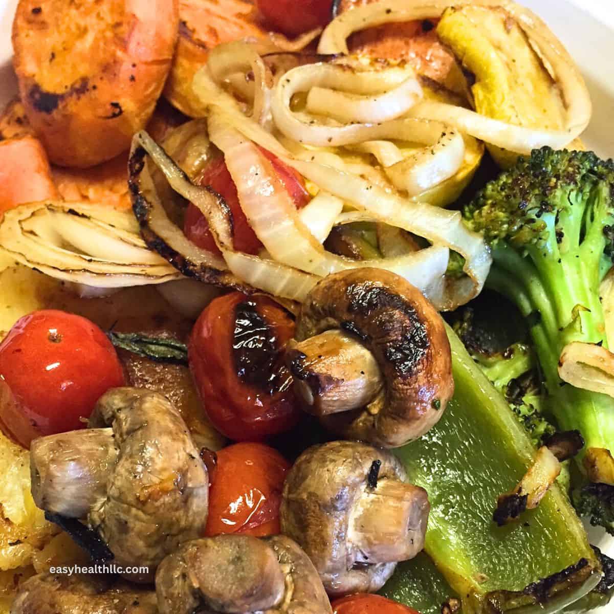 Grilled veggies on platter: onions, broccoli, sweet potatoes, mushrooms