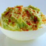 avocado stuffed egg half with paprika dusted on top
